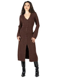 A woman modeling a long brown knit cardigan dress with a V-neck, front buttons, and long sleeves, paired with black knee-high boots, against a light gray studio background.