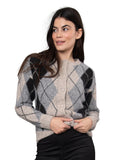 A woman wearing a fuzzy knit cardigan with a gray, black, and beige argyle pattern, posed against a solid gray studio background.